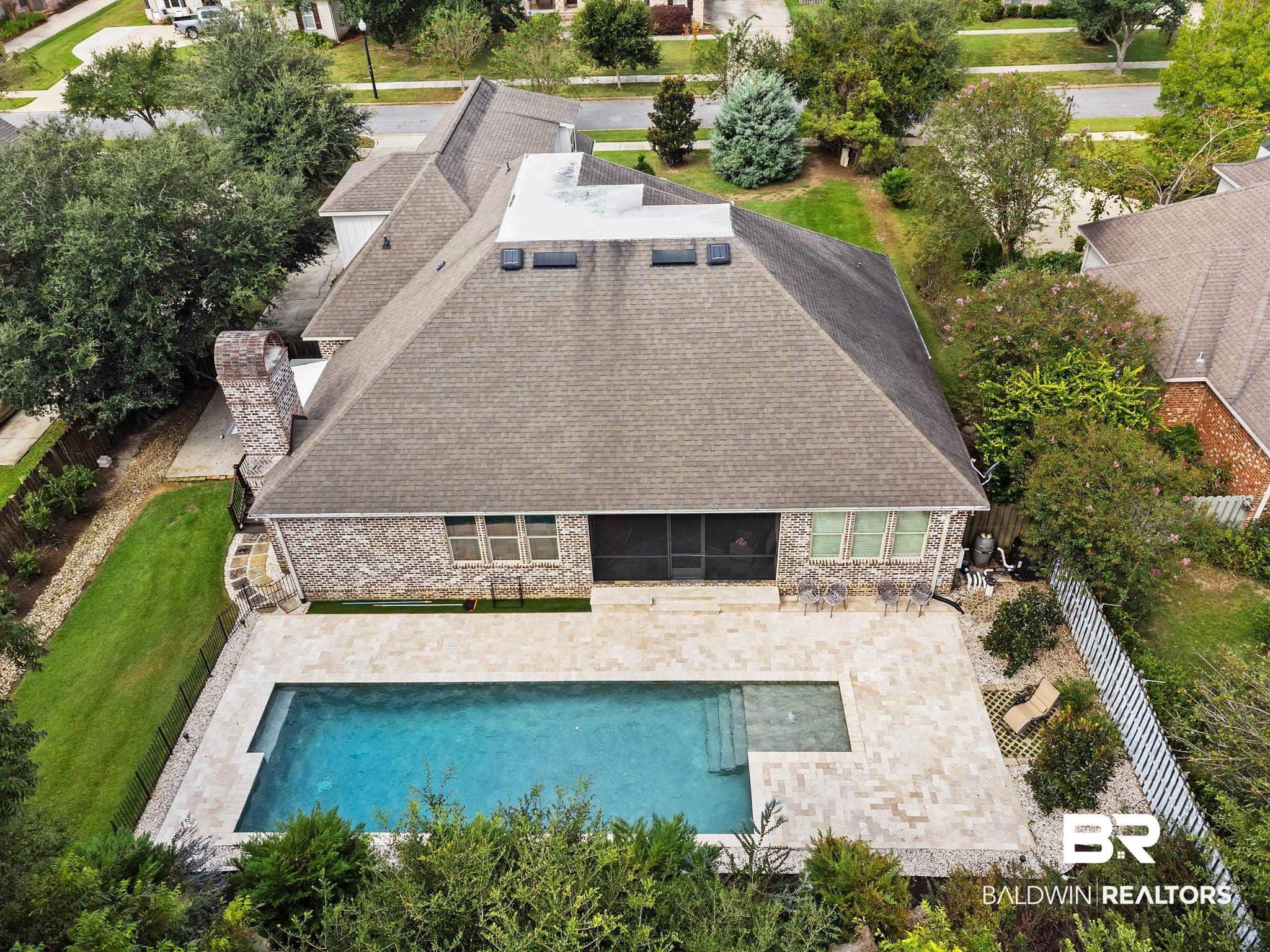 Image 2: View from above of property featuring a pool area