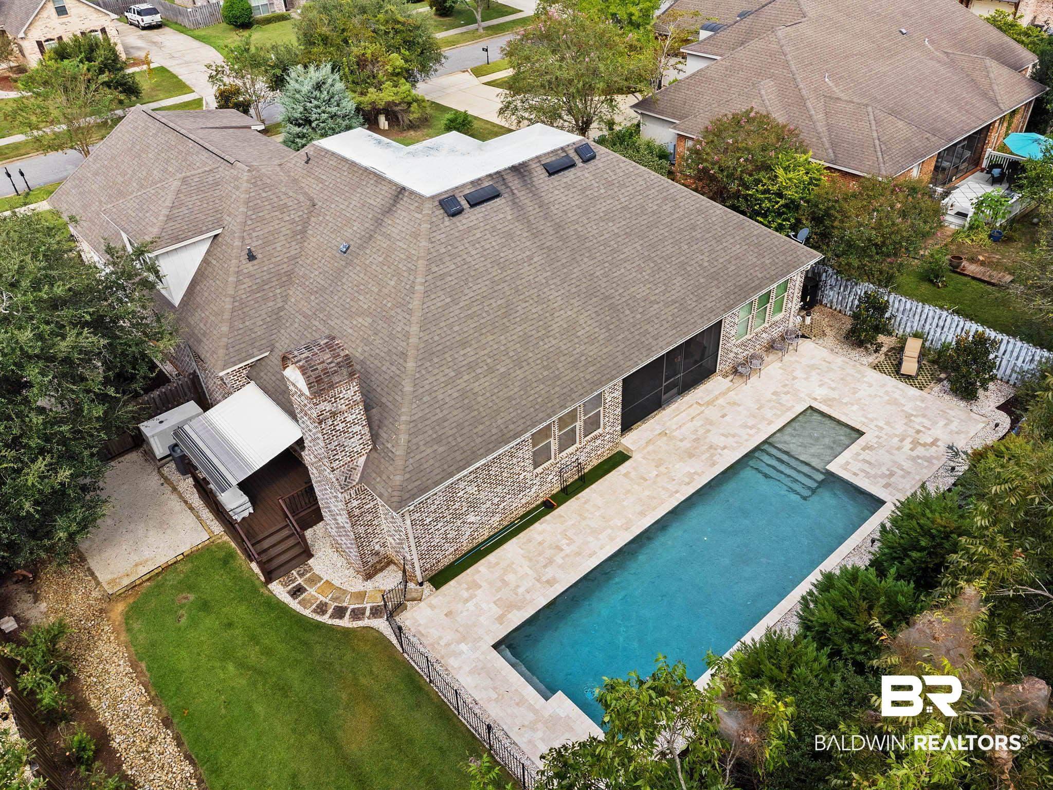 Image 3: View from above of property featuring a pool area