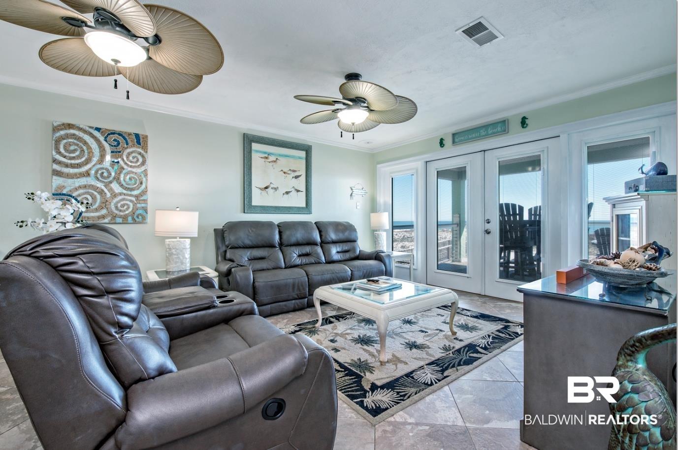 Image 2: Living room featuring french doors, crown molding, and ceiling fan