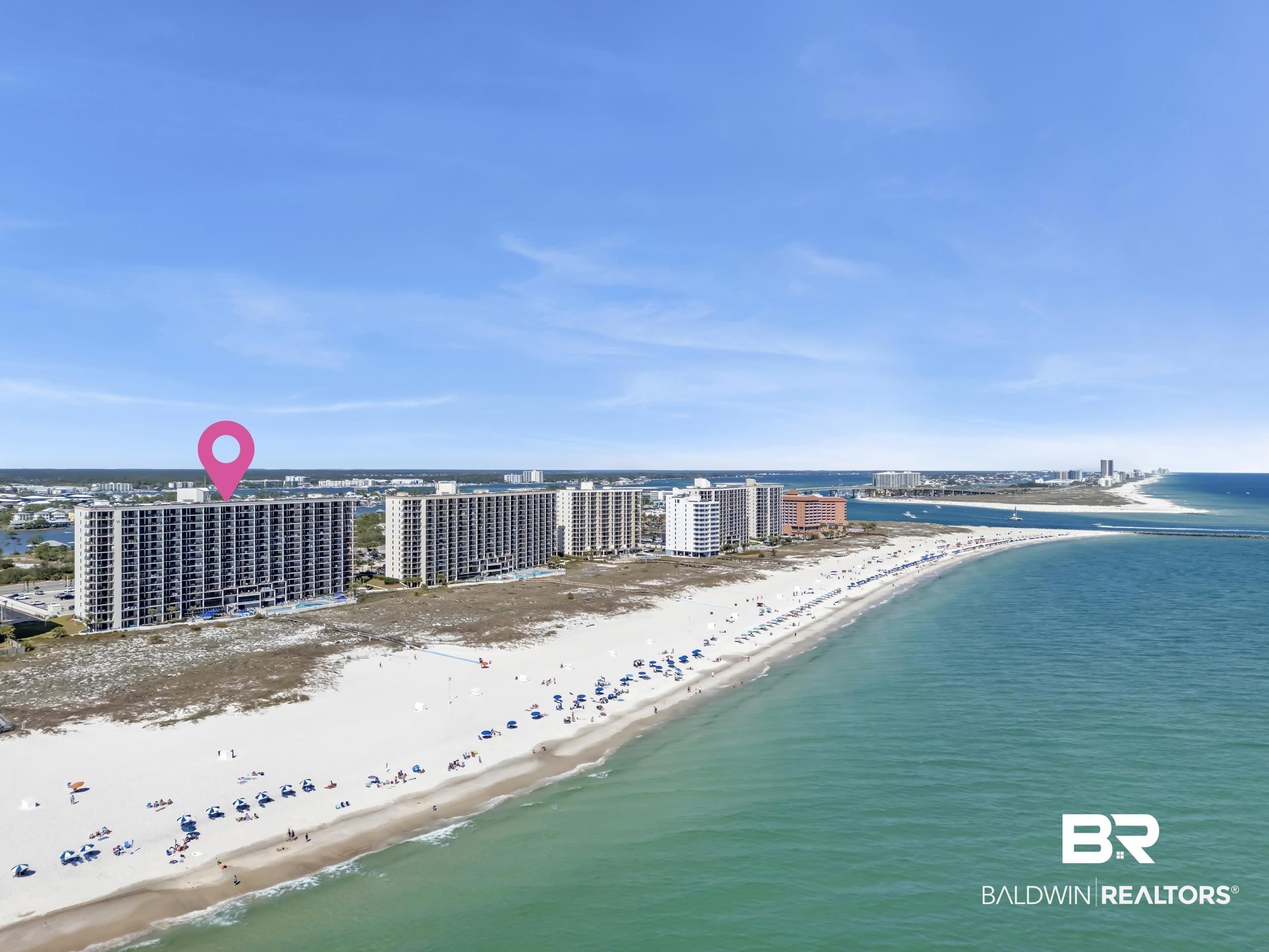 Image 2: View of urban area with waterfront with a beach