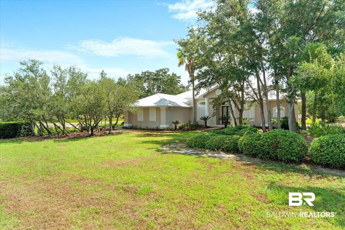Image 2: Spacious front lawn with mature trees and established shrubbery