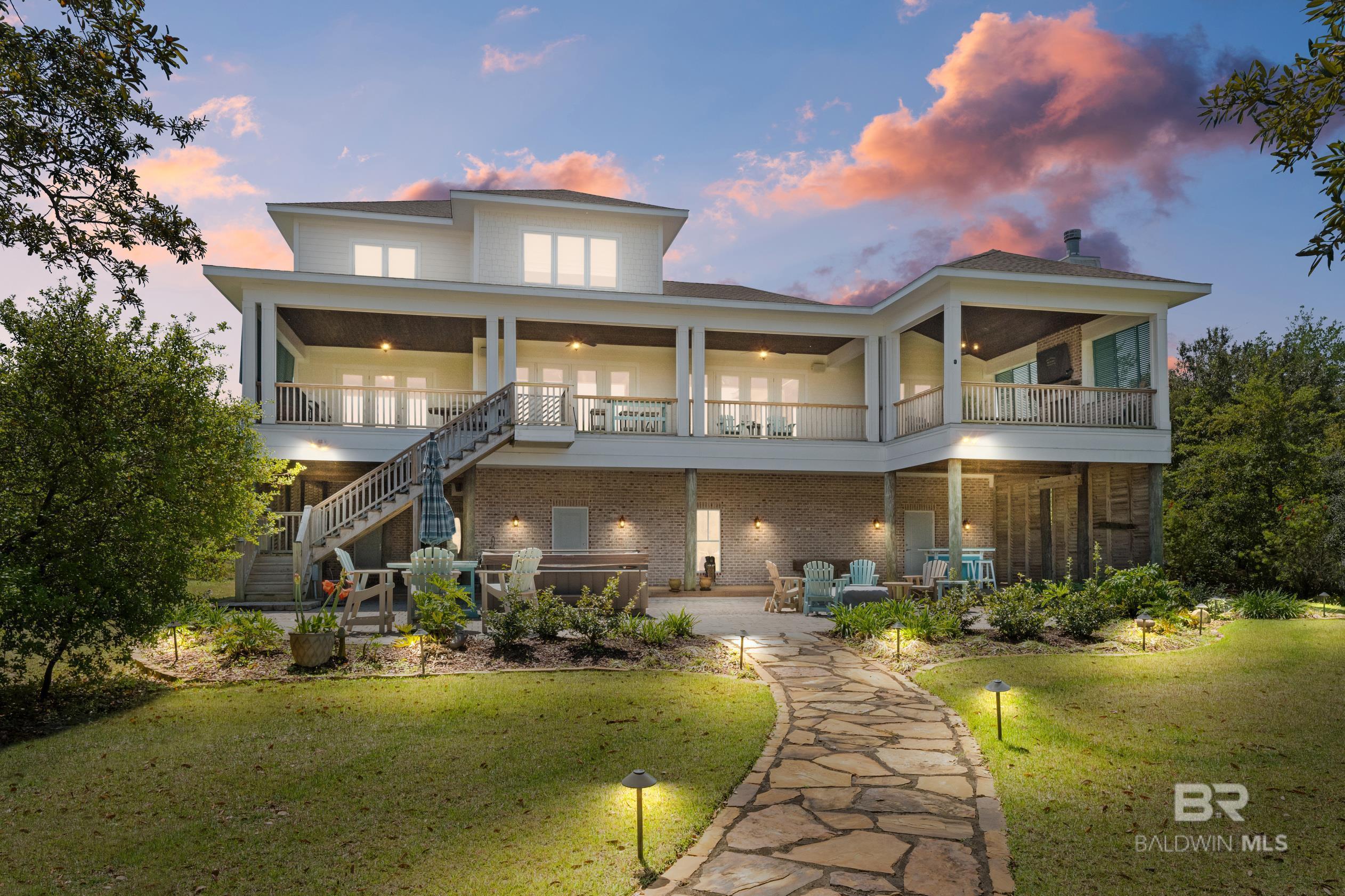 Image 3: Rear view of home at dusk
