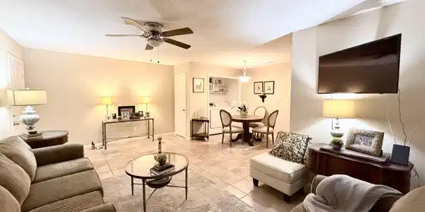 Image 3: Tiled living area with a textured ceiling and ceiling fan