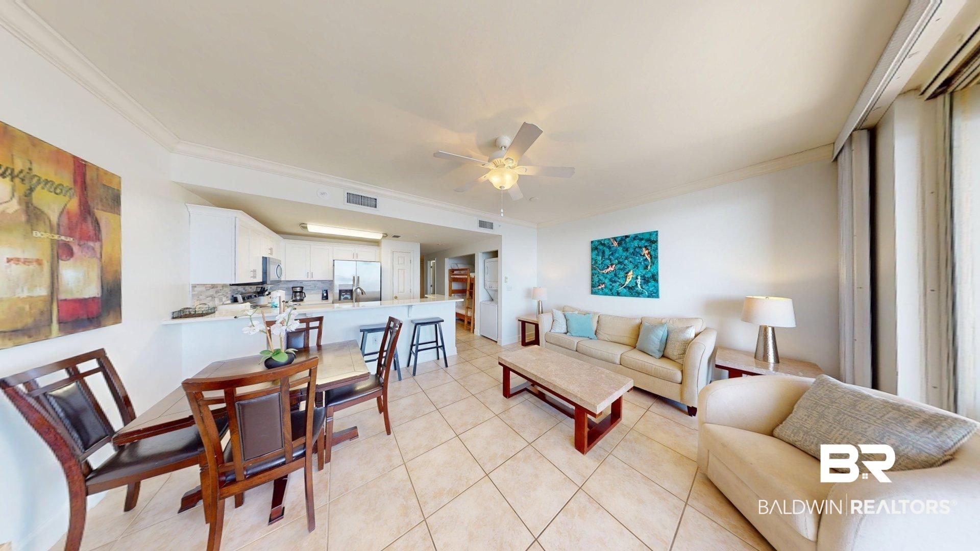 Image 2: Living room featuring crown molding, ceiling fan, and light tile patterned floors