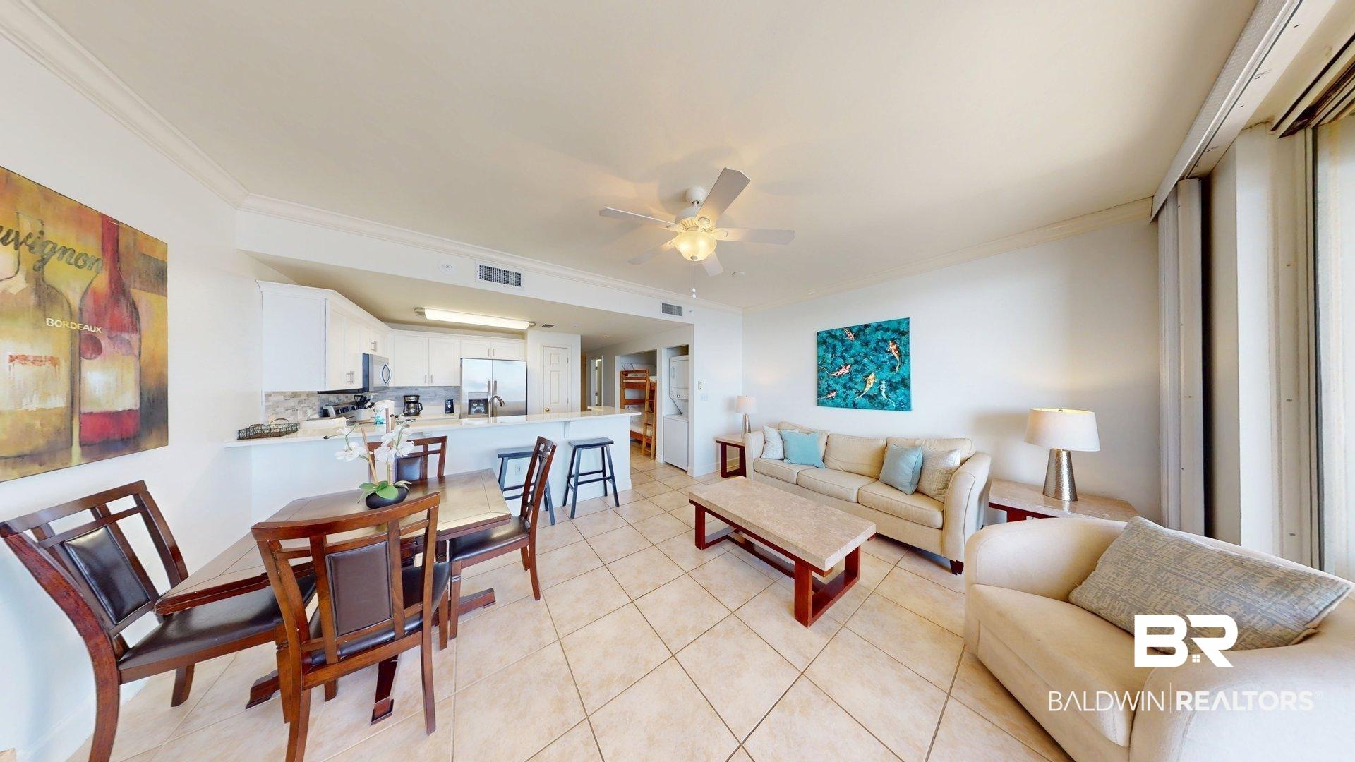 Image 3: Living room featuring ornamental molding, a ceiling fan, and light tile patterned floors