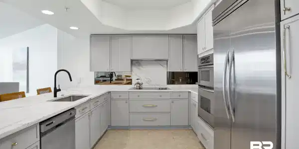 Image 4: Kitchen featuring light gray cabinetry, stainless steel appliances, white countertops, and recessed lighting