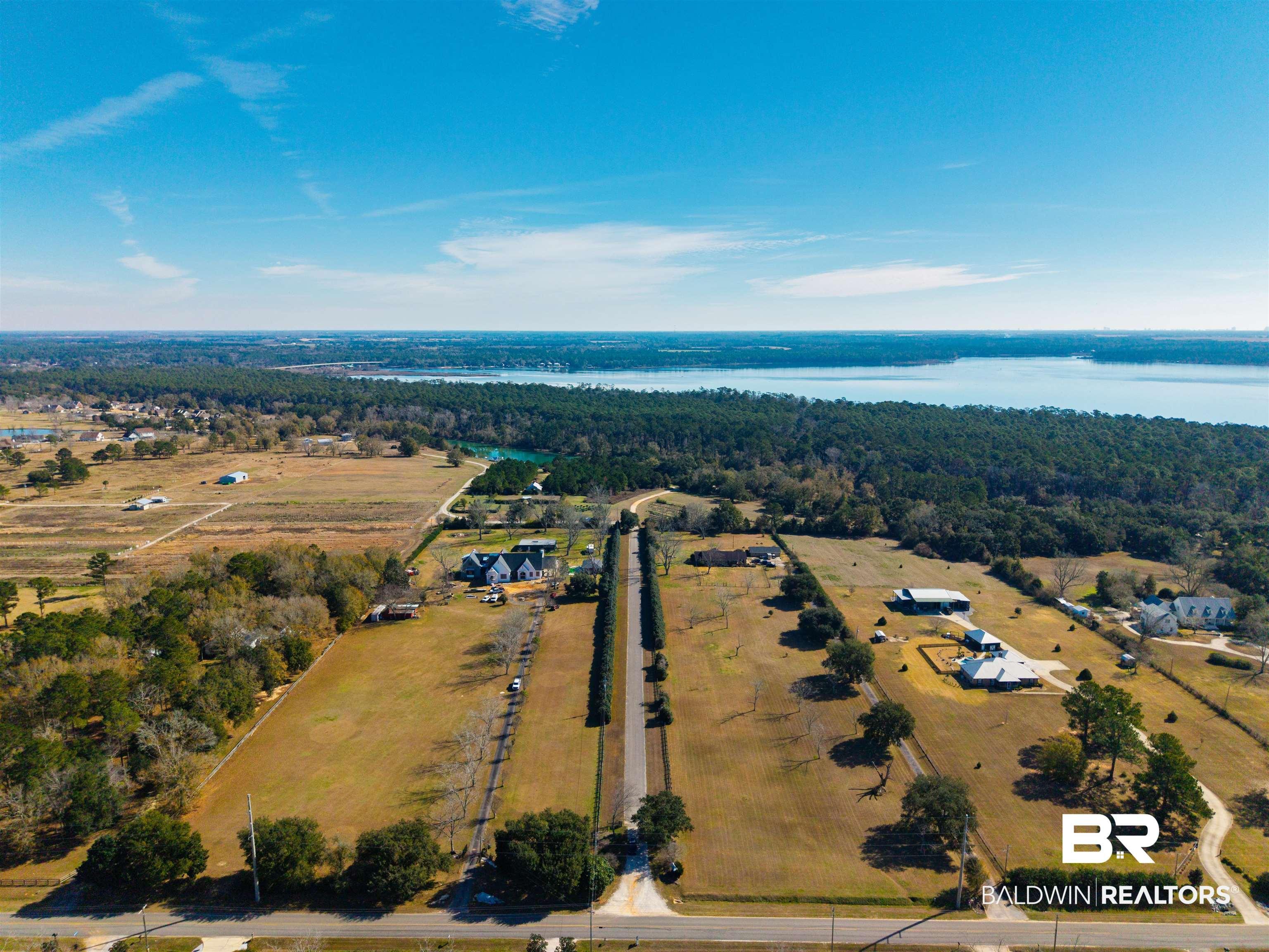 Image 2: Bird's eye view of a heavily wooded area and a nearby body of water