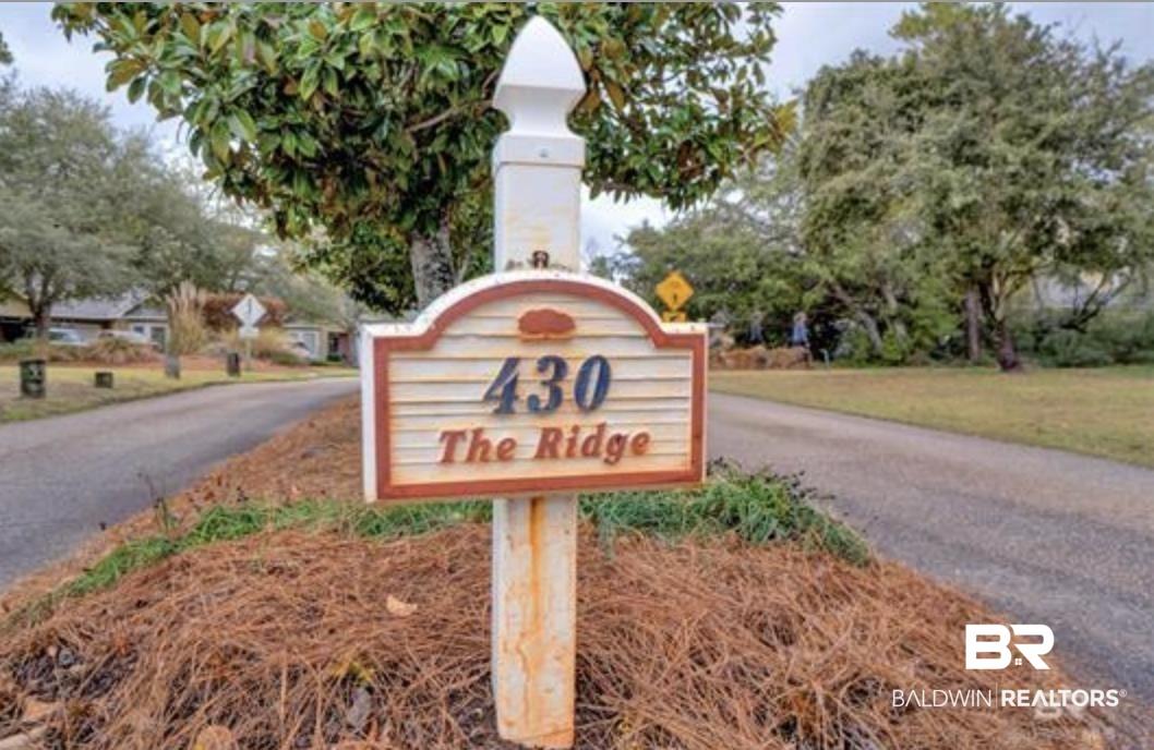 Image 3: Property identifier sign featuring "430 The Ridge" on a decorative post