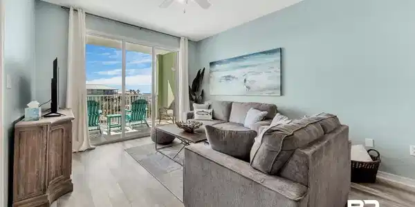 Image 2: Living room with light hardwood / wood-style floors and ceiling fan