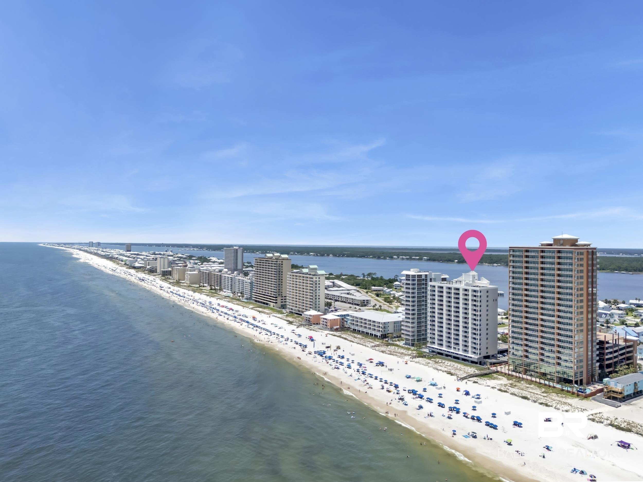 Image 3: Beachfront high-rise building with direct beach access, situated along a long stretch of sandy coastline