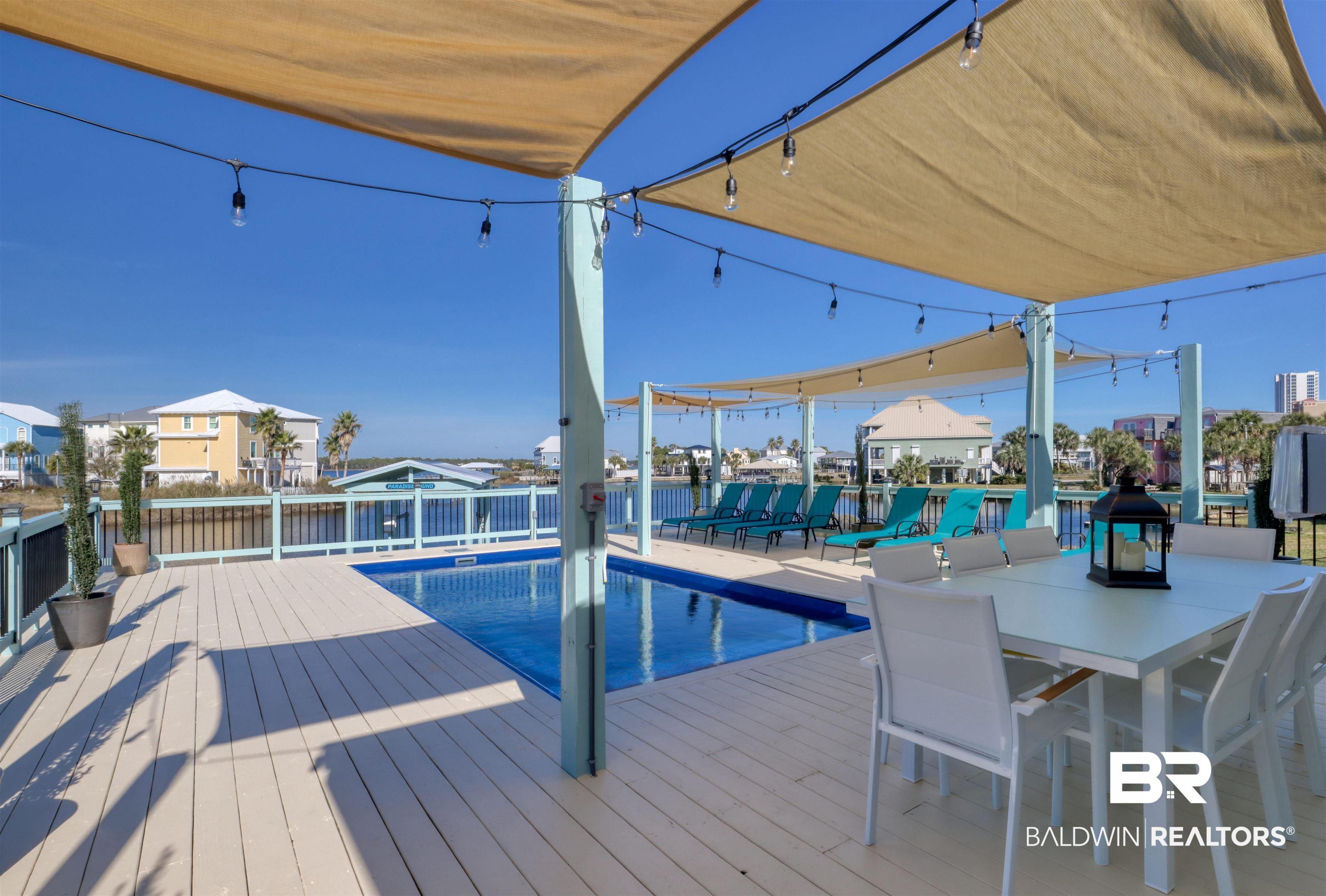 Image 4: View of swimming pool with patio surround