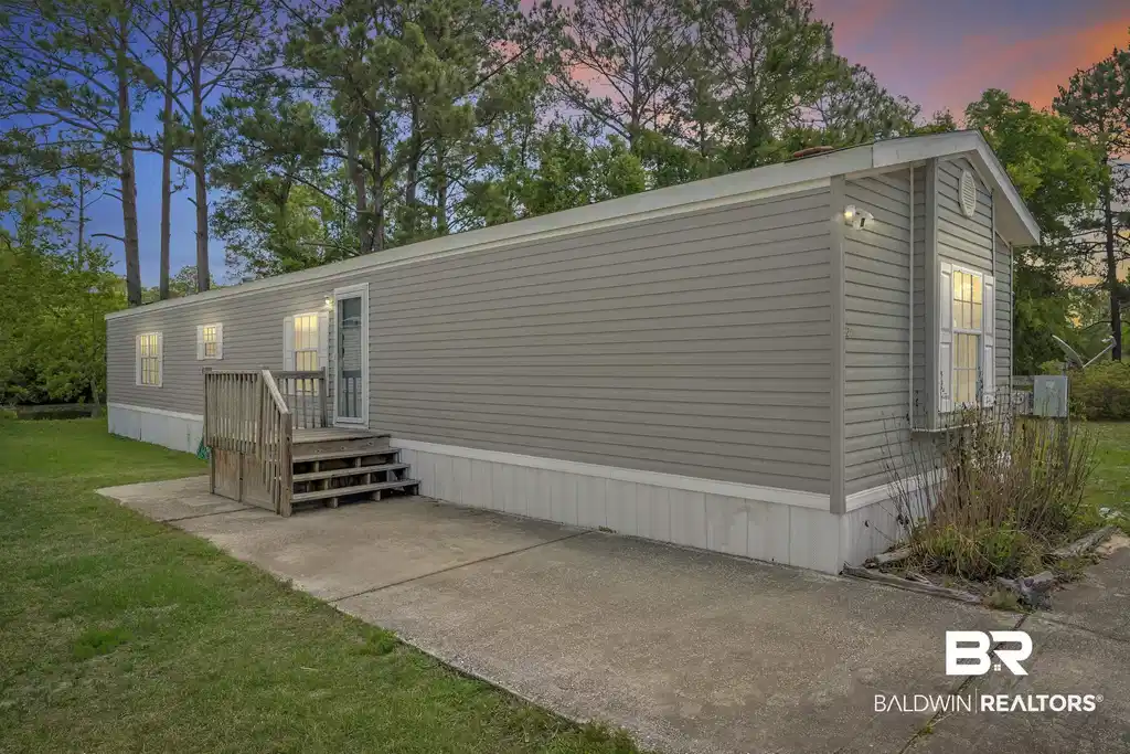Image 1: Rear view of house with a yard