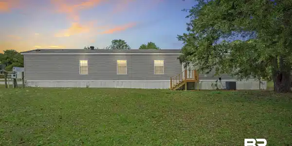 Image 2: Rear view of property with a yard