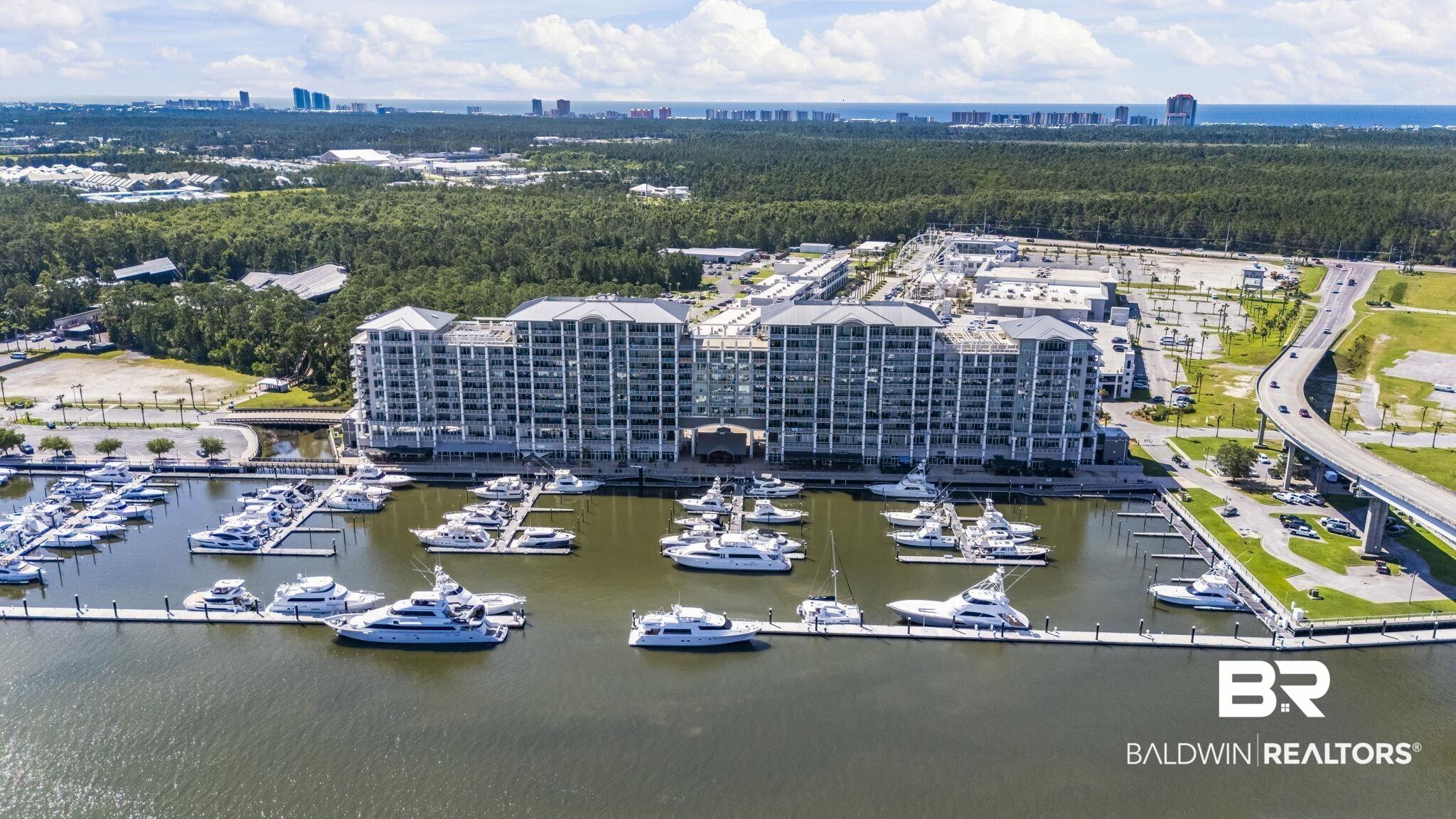 Image 1: Waterfront marina featuring multiple boat slips
