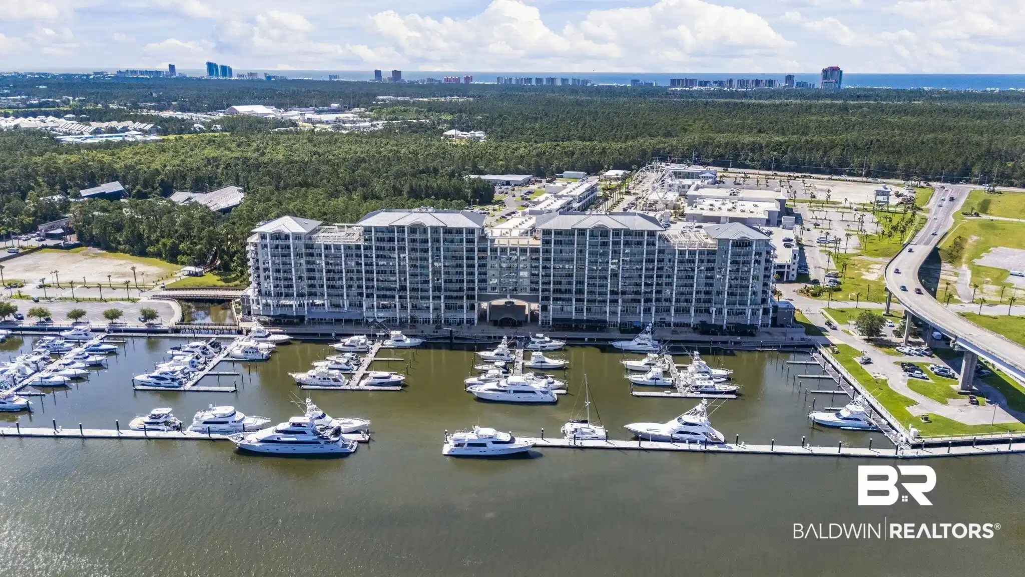 Image 1: Waterfront marina featuring multiple boat slips