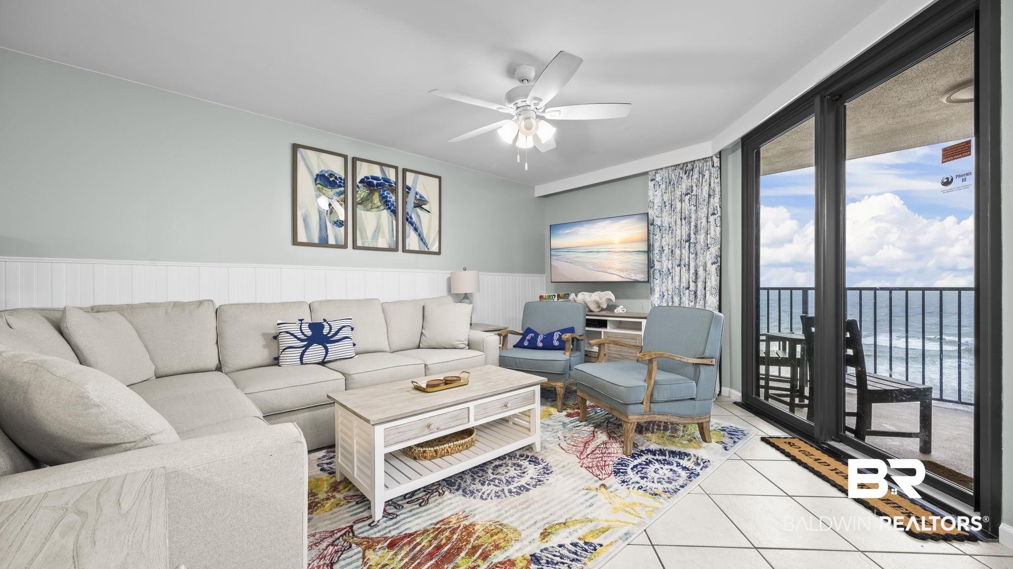 Image 2: Living area with light-colored walls and wainscoting