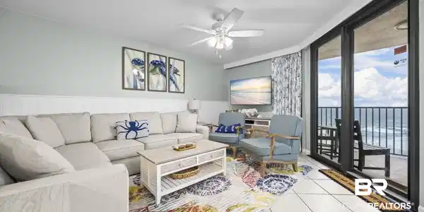 Image 2: Living area with light-colored walls and wainscoting