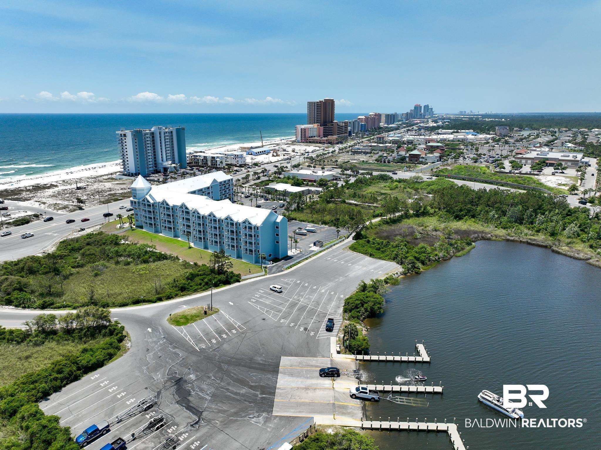 Image 3: Boat ramp and dock system with multiple boat slips, offering direct water access
