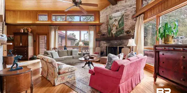 Image 3: Vaulted wood-paneled ceiling with exposed beam and ceiling fan