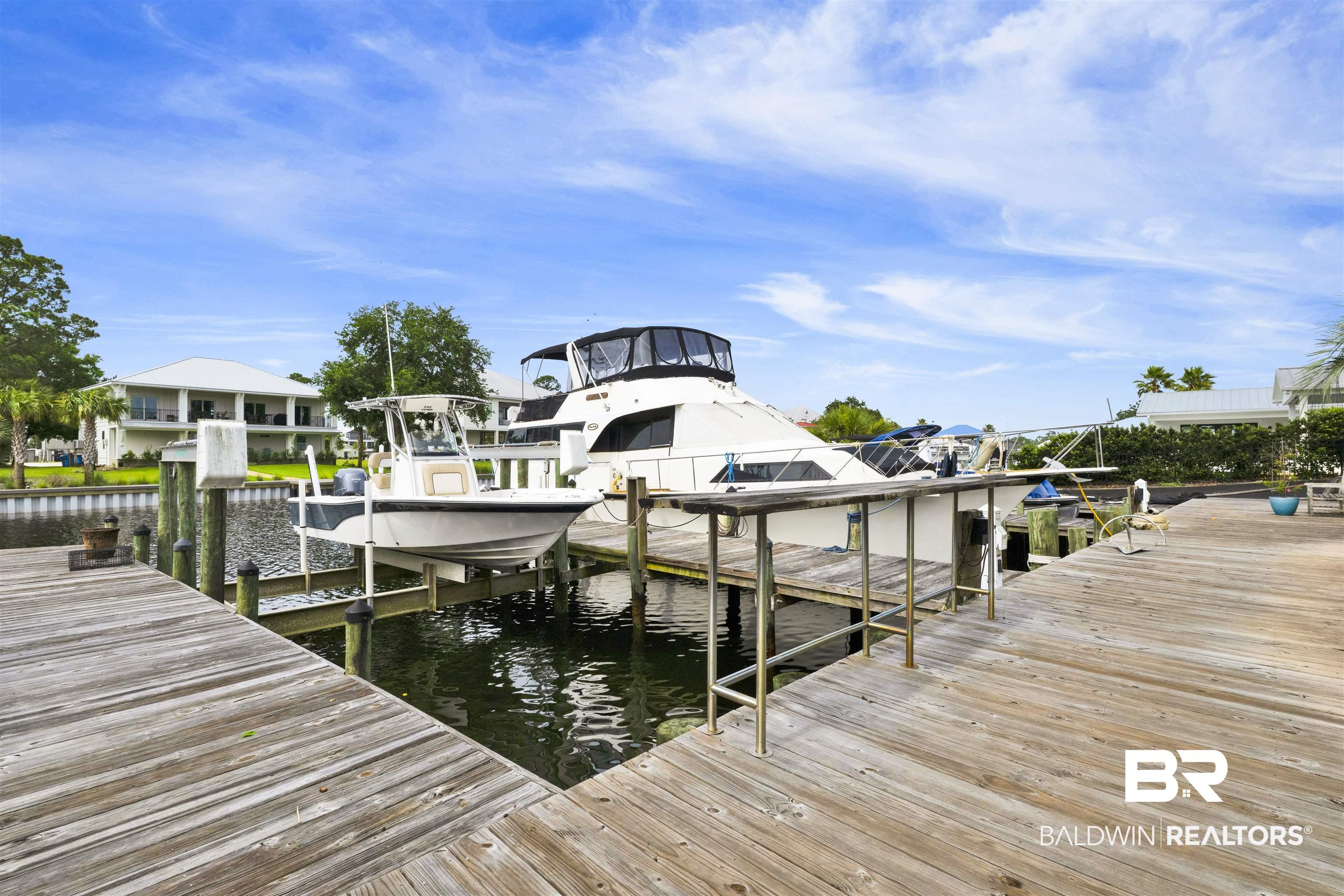 Image 3: Expansive wood dockage with direct water access
