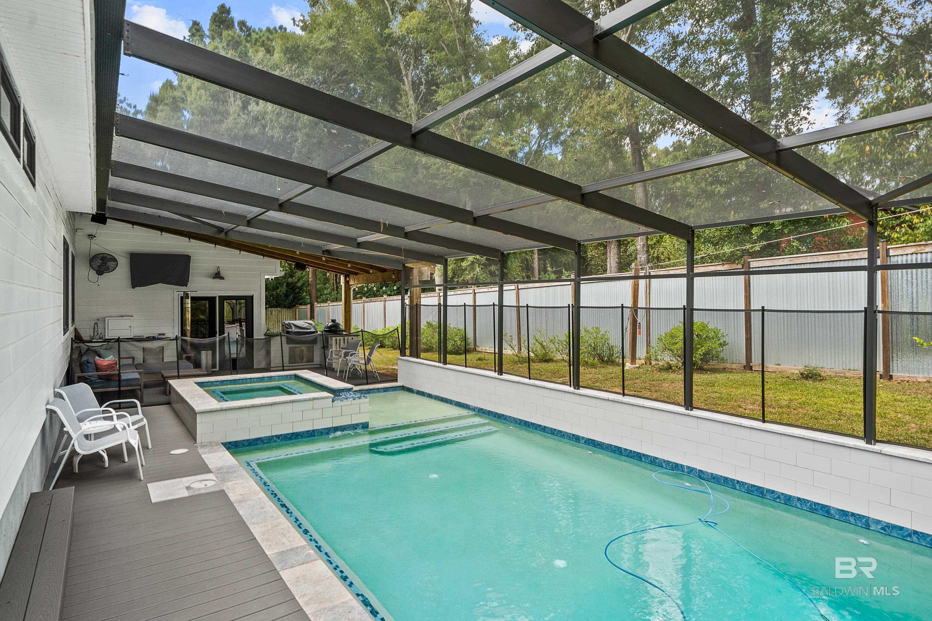 Image 3: Swim or relax in your private pool and spa