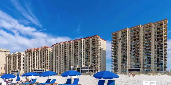 Image 2: Beachfront high-rise condominiums featuring multiple stories of private balconies