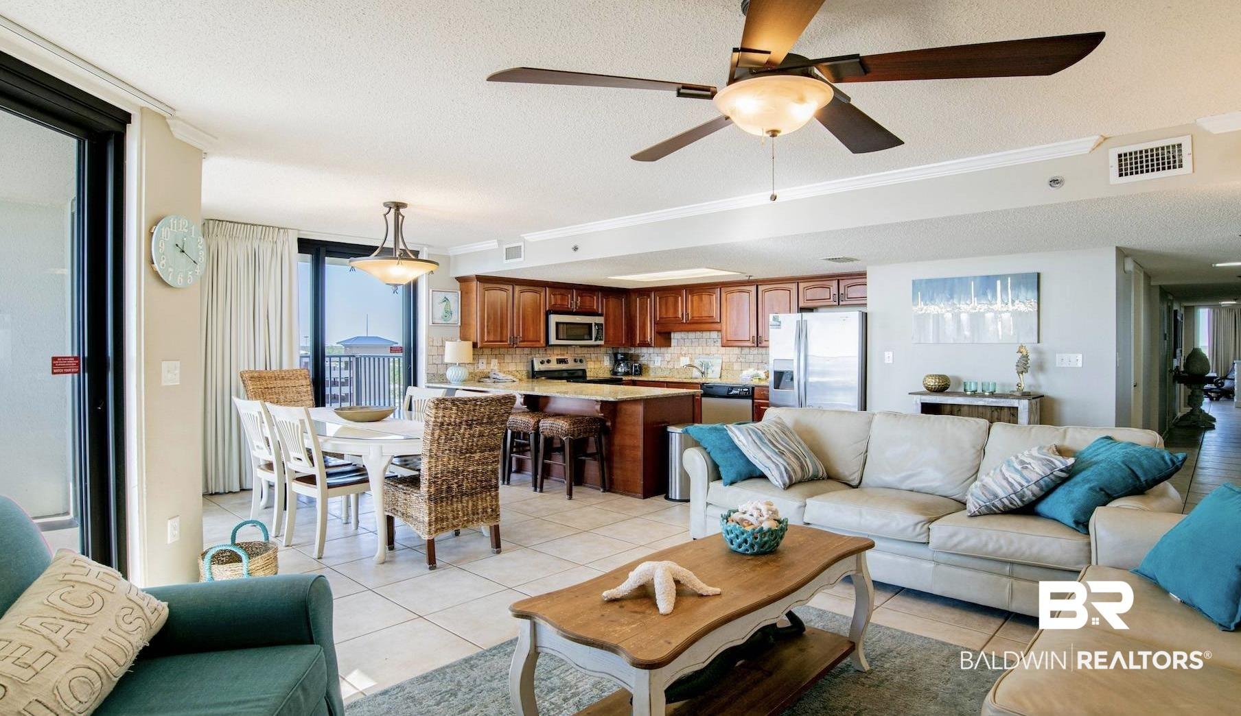 Image 4: Open-concept living area featuring tile flooring and a ceiling fan