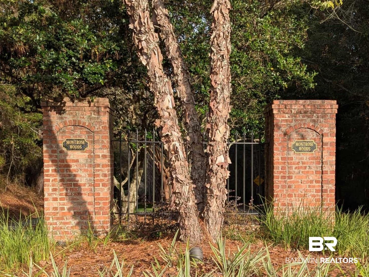 Image 1: Community / neighborhood sign featuring a gate