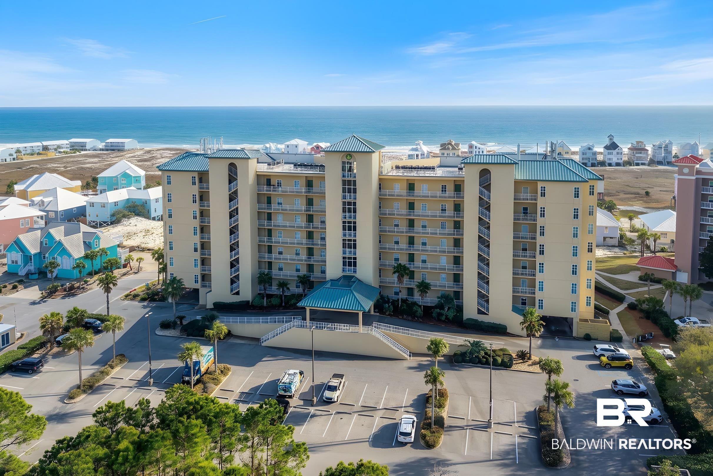 Image 1: View of apartment building / complex featuring a water view