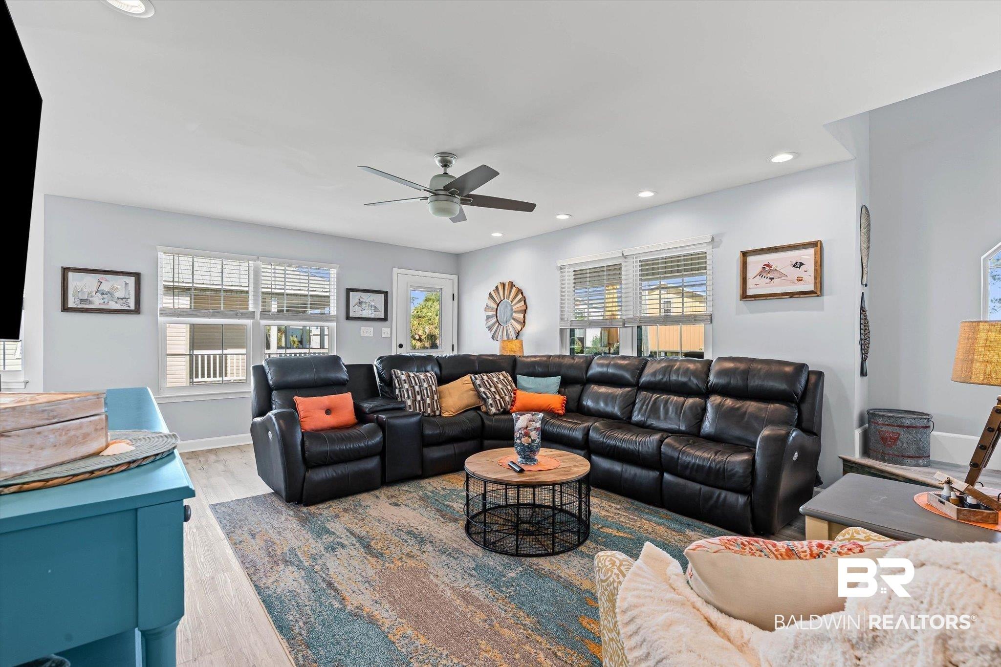 Image 3: Living area with recessed lighting, wood finished floors, and ceiling fan