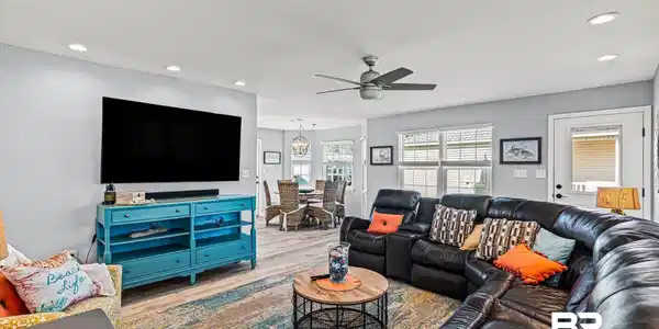 Image 4: Living room with recessed lighting, wood finished floors, and a ceiling fan