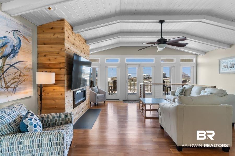 Image 3: Living area with wood finished floors, ceiling fan, and wooden ceiling