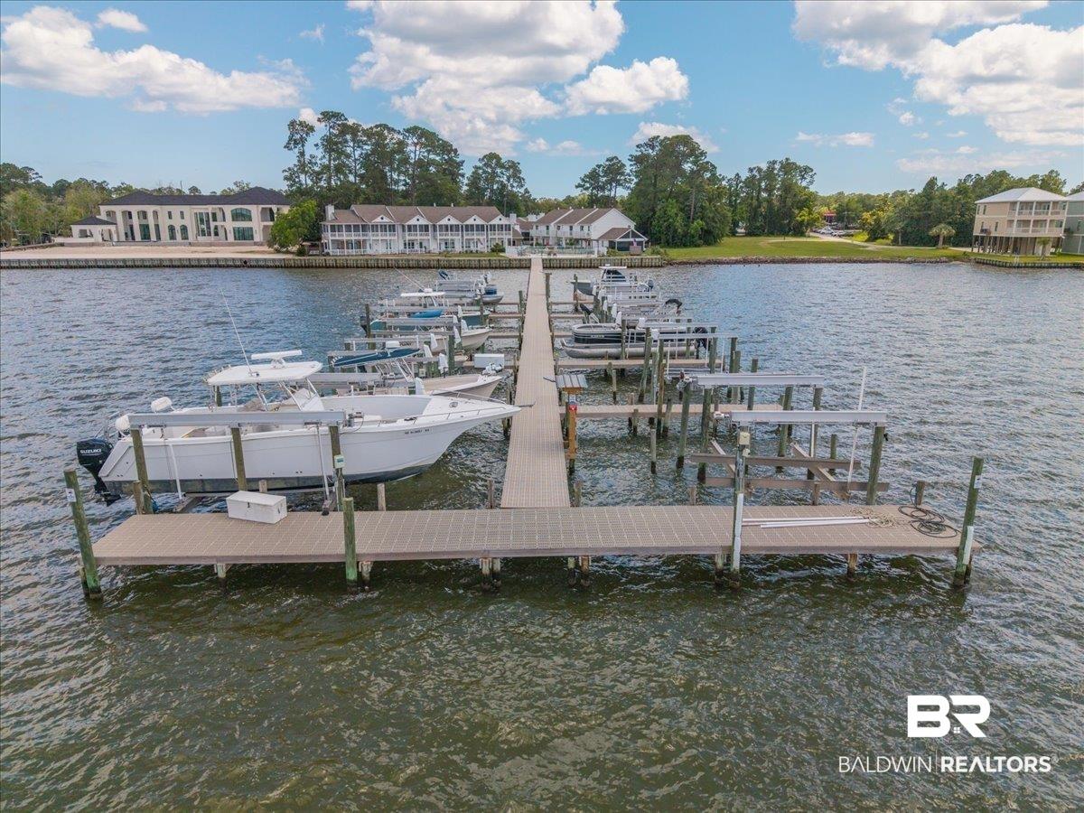 Image 3: Private boat dock featuring multiple slips and boat lifts