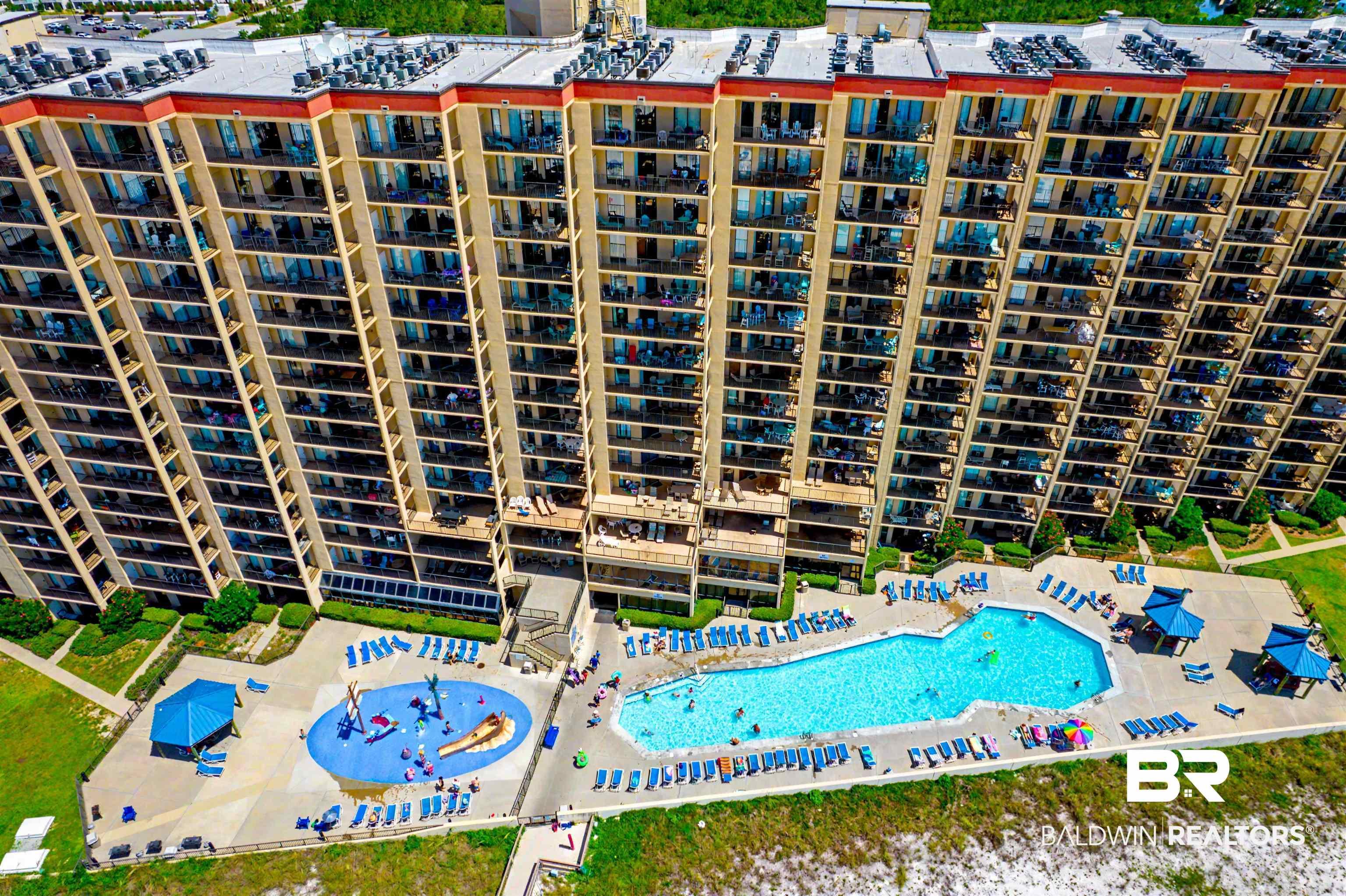 Image 2: Multi-story residential building with private balconies