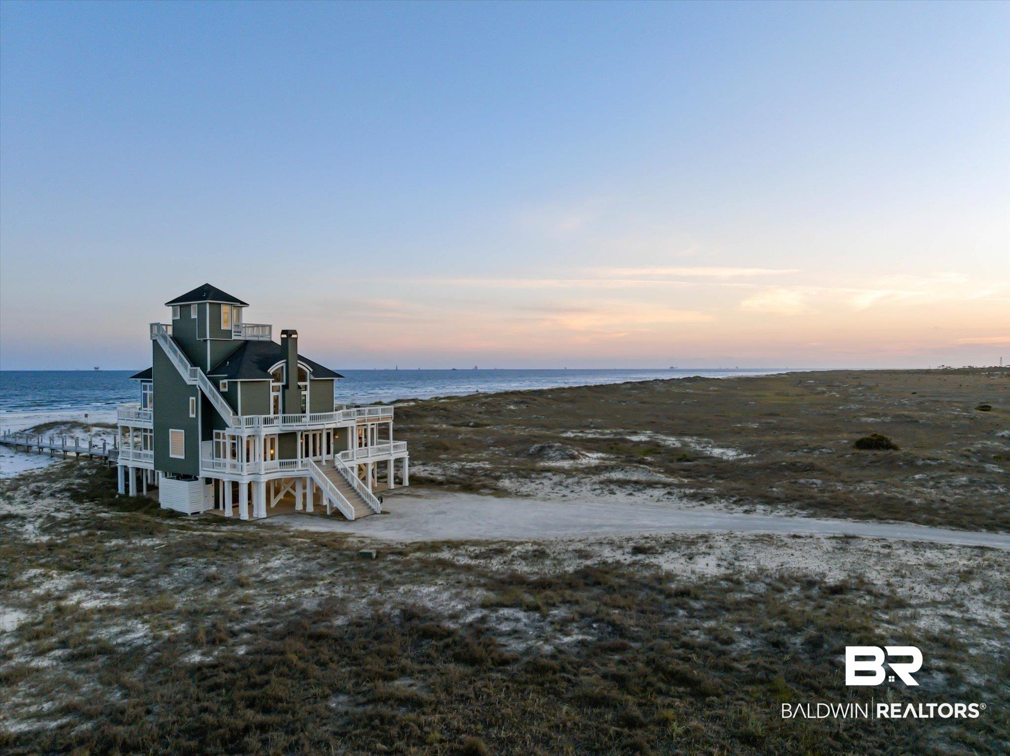 Image 4: Elevated coastal residence featuring multiple balconies and a prominent observation tower
