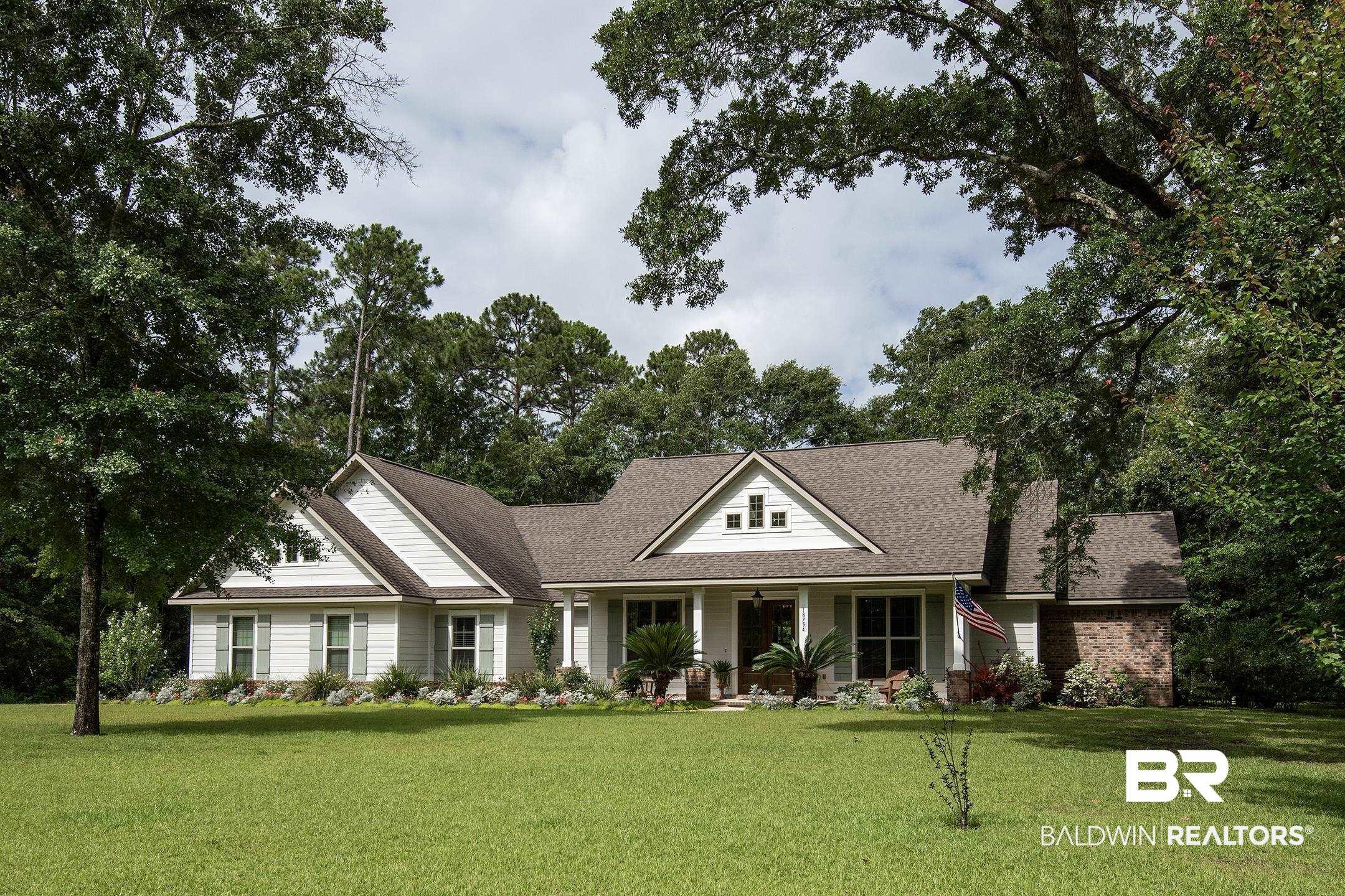 Image 1: White siding exterior featuring multiple gables and a covered entry