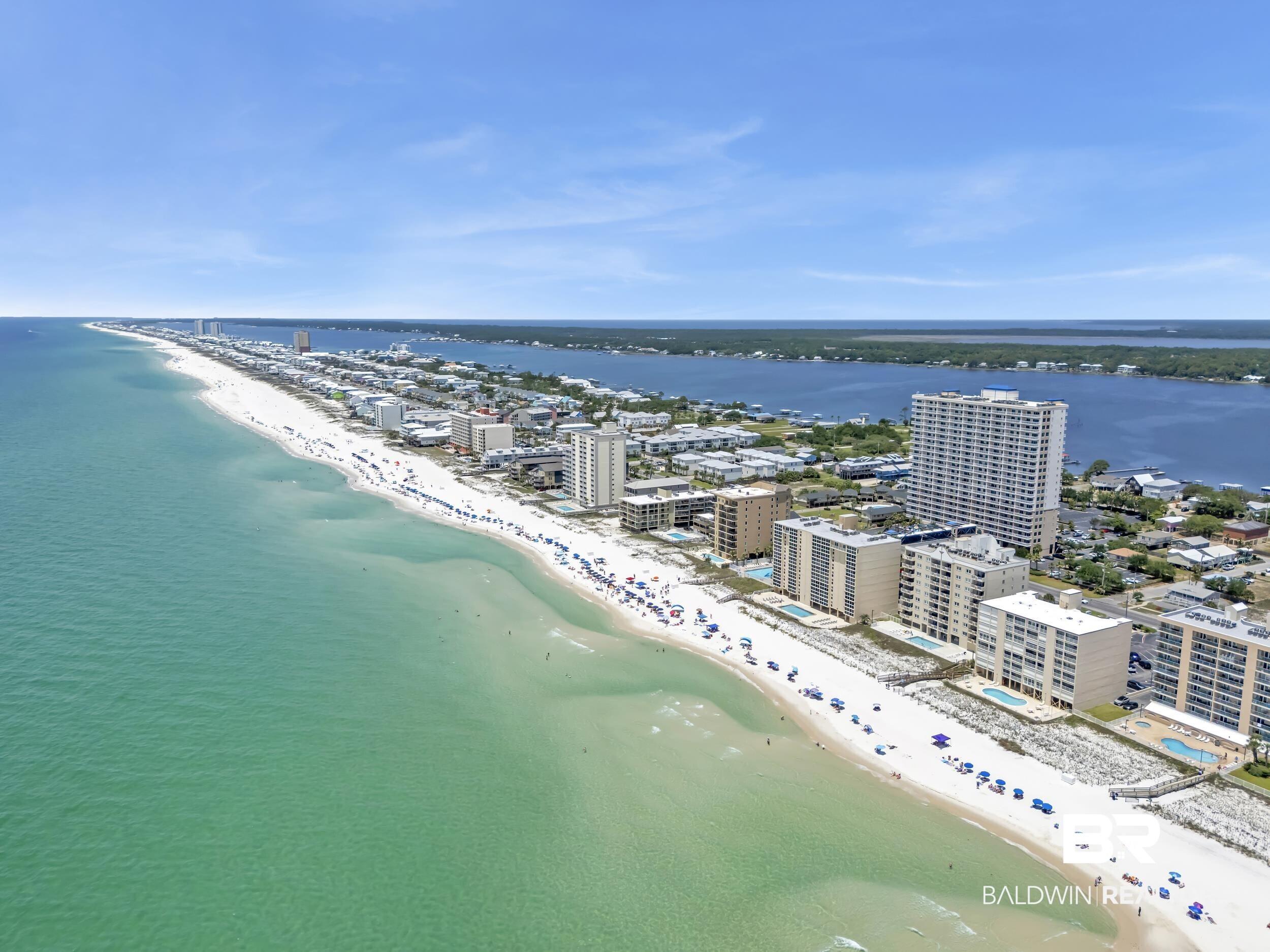 Image 3: Expansive white sand beachfront with direct access to turquoise waters