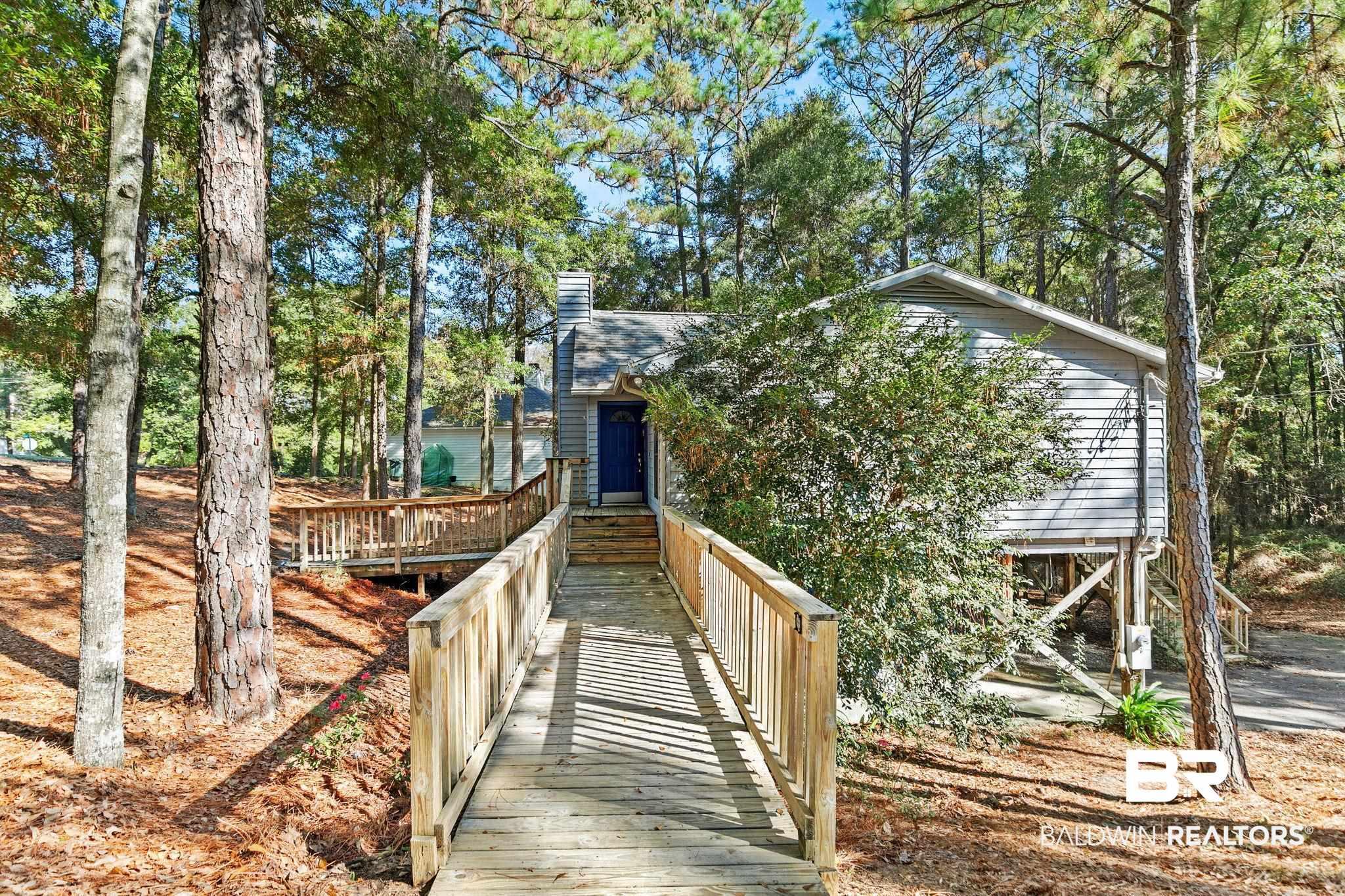 Image 4: View of home's community with a deck