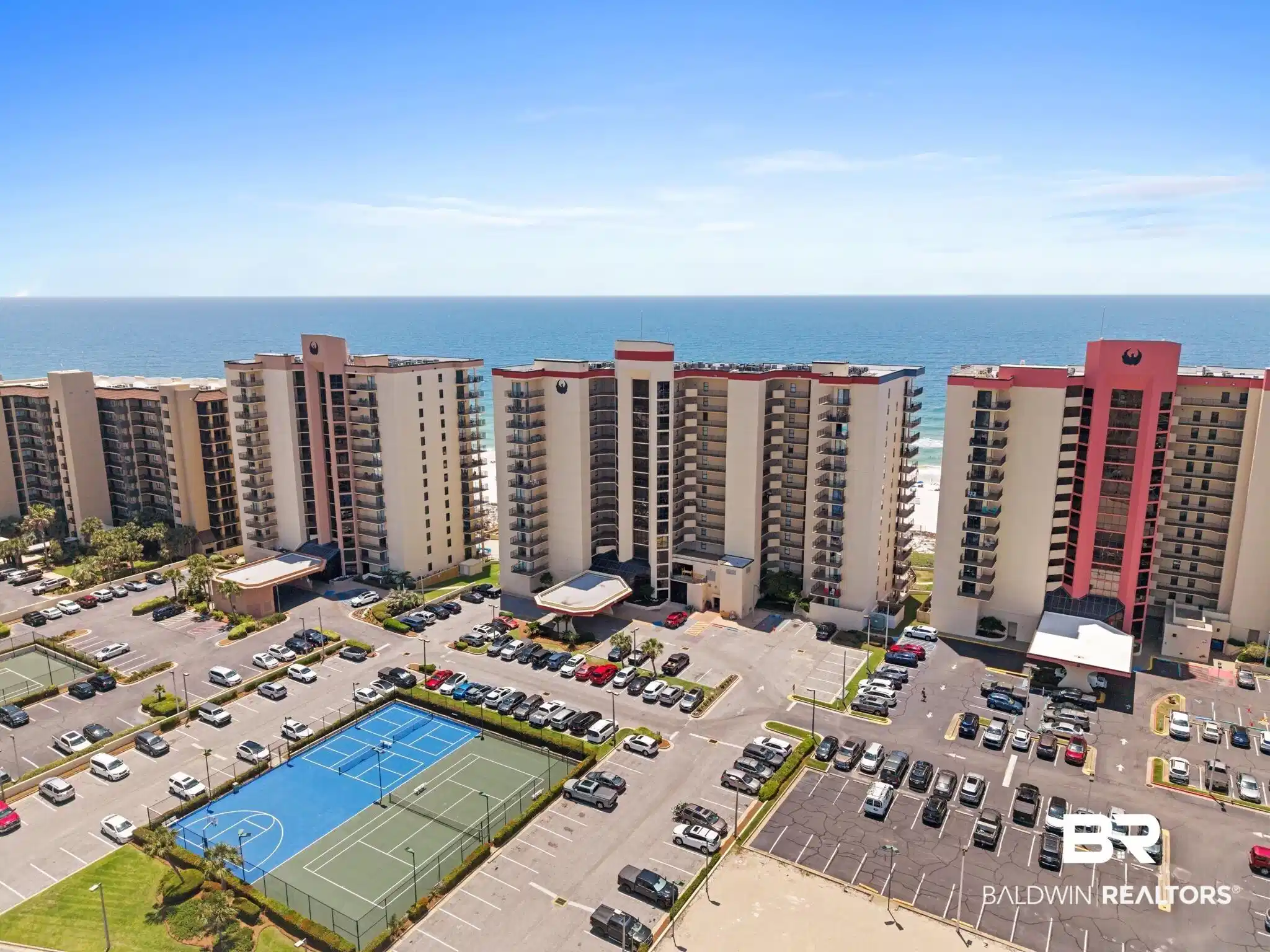 Image 1: Oceanfront multi-story buildings with numerous private balconies