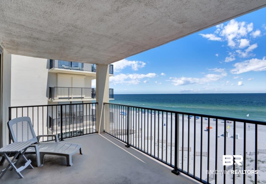 Image 2: Private balcony with expansive ocean and white sand beach frontage