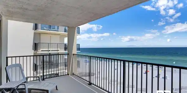 Image 2: Private balcony with expansive ocean and white sand beach frontage