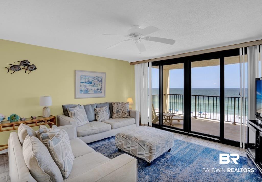 Image 3: Floor-to-ceiling glass doors opening onto a private balcony