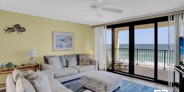 Image 3: Floor-to-ceiling glass doors opening onto a private balcony
