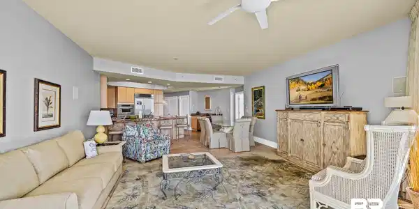 Image 4: Open-concept living space featuring a ceiling fan, recessed lighting, and tile flooring