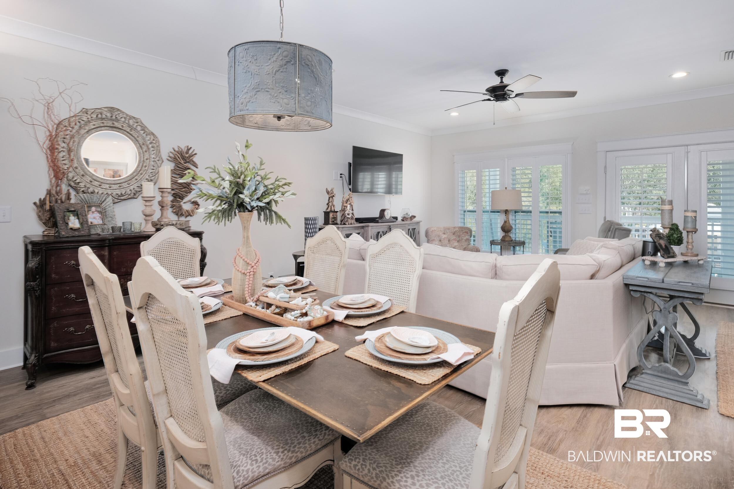 Image 4: Dining space featuring light wood-type flooring, crown molding, a ceiling fan, and recessed lighting