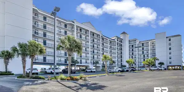 Image 2: View of apartment building / complex with uncovered parking