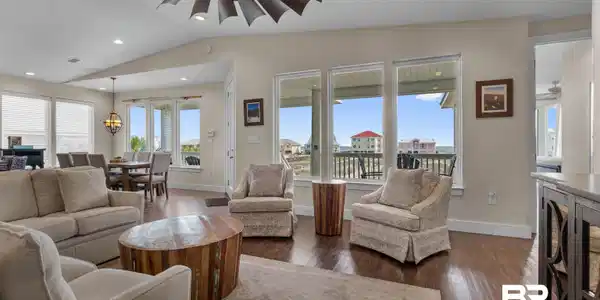 Image 3: Laminate Flooring, Designer Windmill Style Fan, Large South Facing Windows to maximize the Views!