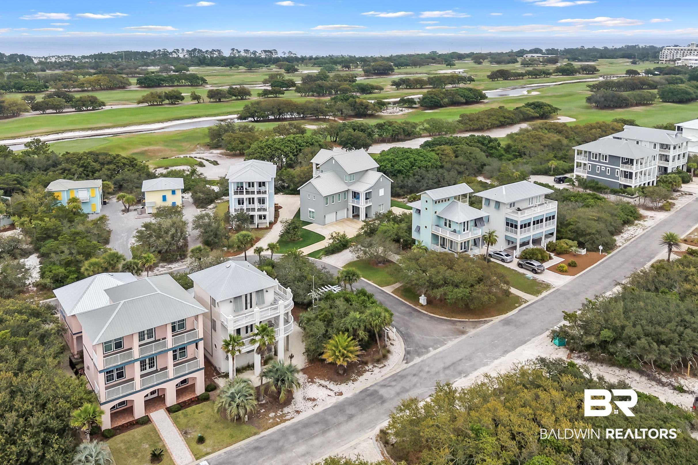Image 4: Coastal residential architecture featuring multiple stories and balconies