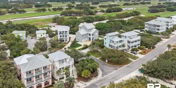 Image 4: Coastal residential architecture featuring multiple stories and balconies