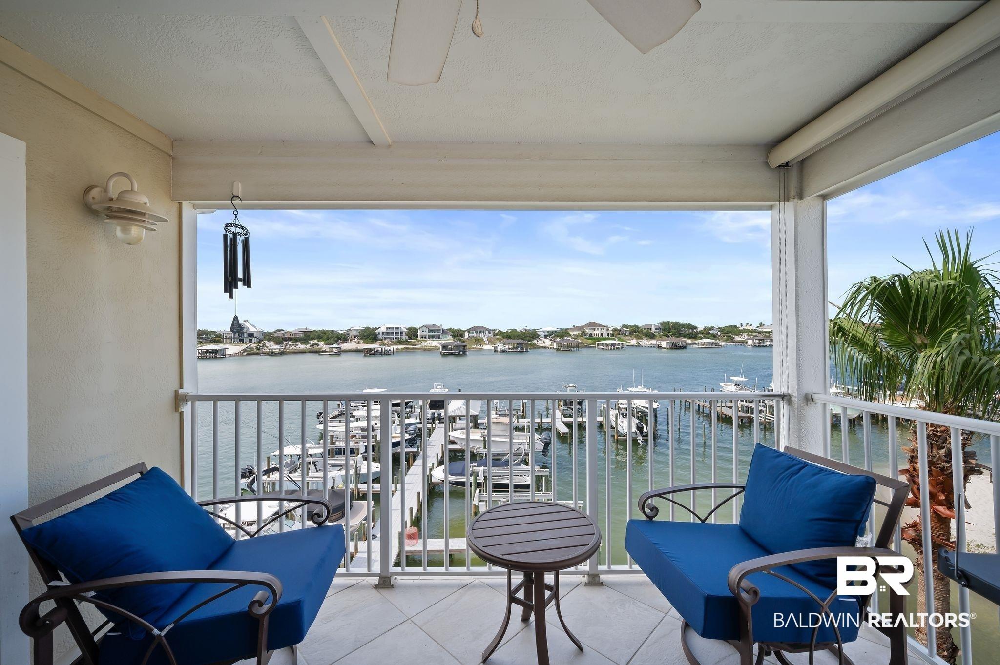 Image 3: Balcony featuring a water view